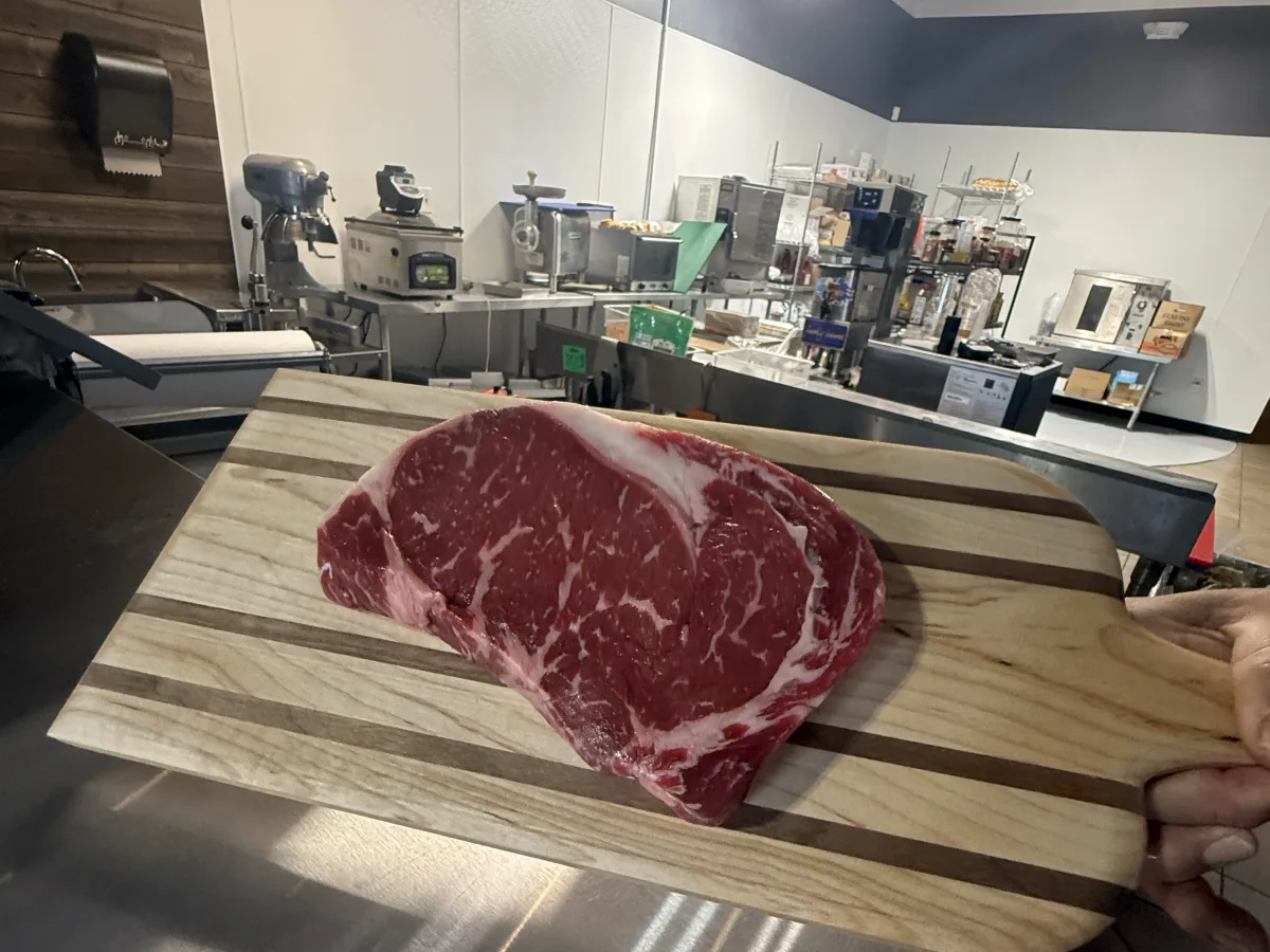 Hand-cut New York strip steak at Grinders Meat Market